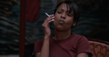 Nia Long smoking a cigarette (or weed)
