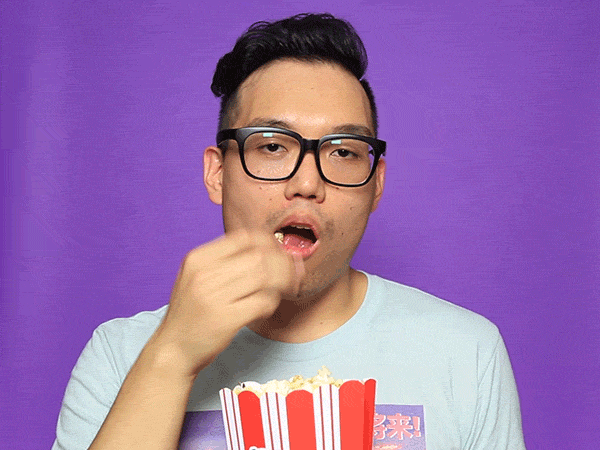 colbert eating popcorn gif