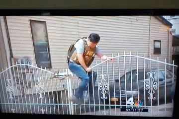 fbi agent climbs open gate