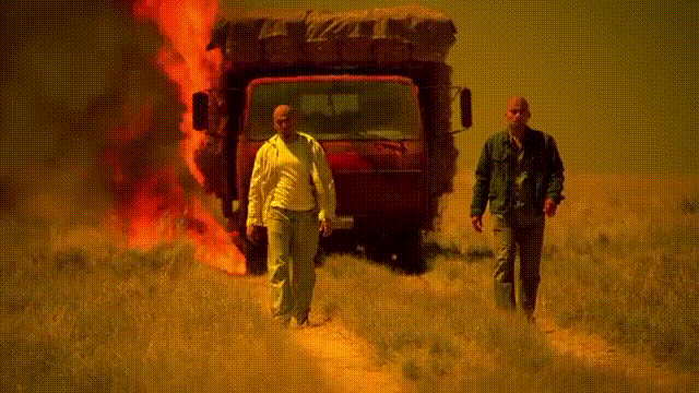 guy walking away from explosion gif