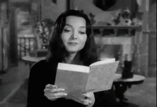 reading,book,morticia addams,the addams family,omg,shock,wtf,reactions