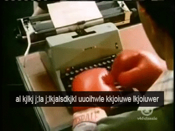 typing with boxing gloves,typo,typewriter