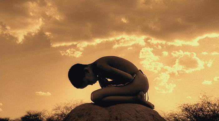boy praying,cinemagraph,sepia,ashes and snow