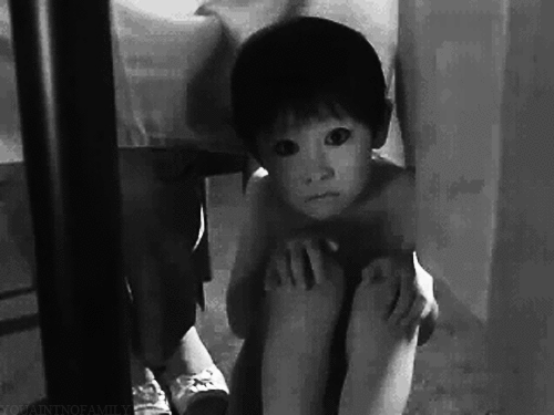 boy,strange looking child,black and white,scream,womans legs under the table,movies,scary movie,ghost boy,child under the table