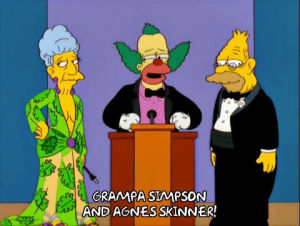 agnes skinner,grandpa simpson,episode 17,season 13,dress,krusty the clown,stage,podium,speaker,introduction,13x17