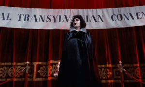 confused travolta,rocky horror picture show,tim curry,cape