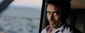 robert downey jr,smiling,driving,suspicious,the look