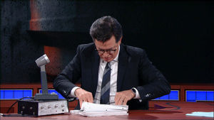 searching,receipts,stephen colbert,confused,reading,notes,late show