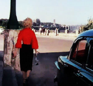marilyn monroe,ass,walking away,walking out,movies,70s,parking lot,woman in red blouse