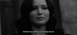 katniss,movie,film,black and white,smile,sad,smiling,quote,the hunger games,katniss everdeen,quotes,sadness,hunger games,grey,black white,black n white,sadly
