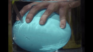 slow mo,hand,balloon,underwater,slow motion,popping