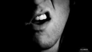 music video,black and white,singing,lips,mouth,punk rock,noir,death rock,calabrese,dark rock,calabrese band,bobby calabrese,jimmy calabrese,davey calabrese,sneer,lip curl,dont care,born with a scorpions touch
