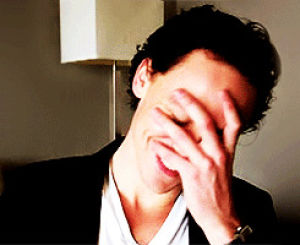 tom hiddleston,laughing,smiling,embarrassed