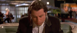 pulp fiction,eating,reactions,john travolta,chewing,hold on,mouth full