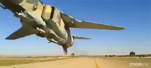 aircraft,libya,mig,fighter jets,crazy,pass,ailane,flyby,cross road