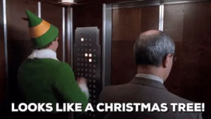 will ferrell,elf,elevator,christmas movies,looks like a christmas tree,button