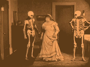 nightgown,movies,fight,punch,attack,rage,lady,skeletons,good shot,old time
