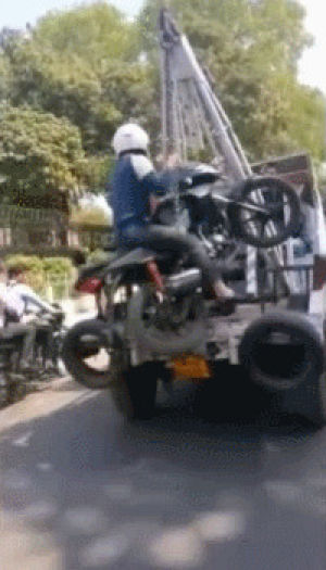 motorcycle,driver,tow,truck,rider