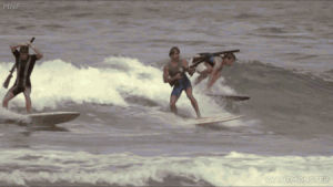 top secret,shotgun,waves,surfer,skeet surfing,skeet,beach,surfboard,the movie,giant monster