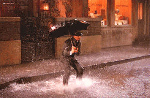 raining,singn in the rain,puddles,raing,jumping like mad in a pile of water