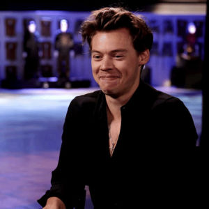 harry styles,laughing,silly,laugh,funny,cute,lol,holding in laugh