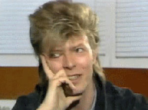mullet,celebrities,smile,photoset,interview,adorable,hair,david bowie,smiling,david bowie interview,expression,bowie,glass spider,rock star,big hair,sighing,fluffy hair,touching face