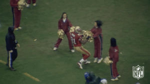 Terrell Owens of the San Francisco 49ers uses the cherrleaders' pom