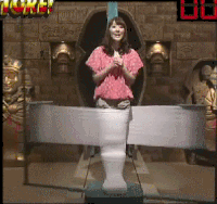 japanese game show character runs from explosions gif